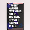A decorative wood plaque with bold, distressed text reading “It Won’t Happen Overnight,” featuring a minimalist style and comic flair.