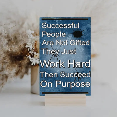Inspirational quote plaque reading “Successful People Are Not Gifted, They Just Work Hard, Then Succeed On Purpose” in bold, modern typeface