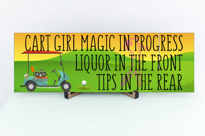 Wooden plaque with bold pink lettering reading “Cart Girl Magic In Progress” featuring cartoon-style golf cart, drink tray, and dollar signs—displayed outdoors.
