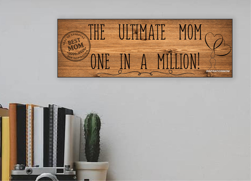 Wooden plaque reading “The Ultimate Mom” in bold script with floral accents and comic-style doodles, perfect for gifting or home décor.