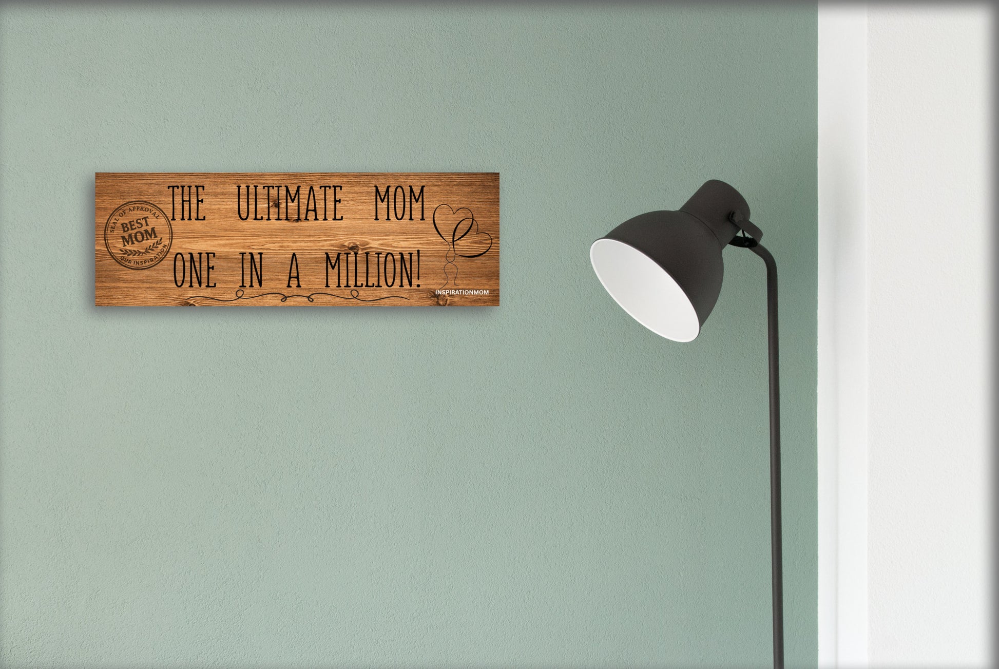 Wooden plaque reading “The Ultimate Mom” in bold script with floral accents and comic-style doodles, perfect for gifting or home décor.
