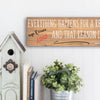 Funny quote plaque with “Everything Happens for a Reason” in bold sarcastic font, mounted on rustic wood-style background.
