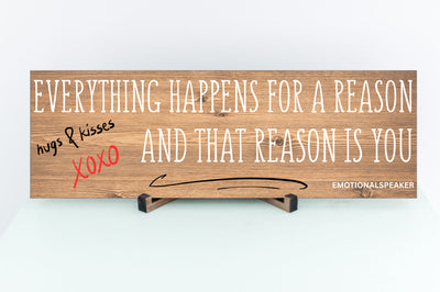 Funny quote plaque with “Everything Happens for a Reason” in bold sarcastic font, mounted on rustic wood-style background.