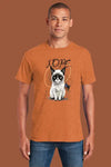 Person wearing an orange t-shirt with a cat graphic and 'NOPE' text on a brown background