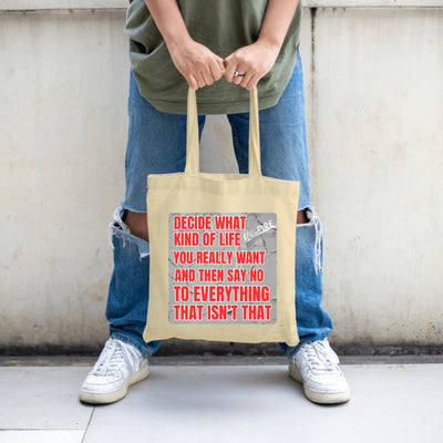 Natural cotton canvas tote bag printed with bold black text: “Decide what kind of life you really want,” accented by clean modern design elements.