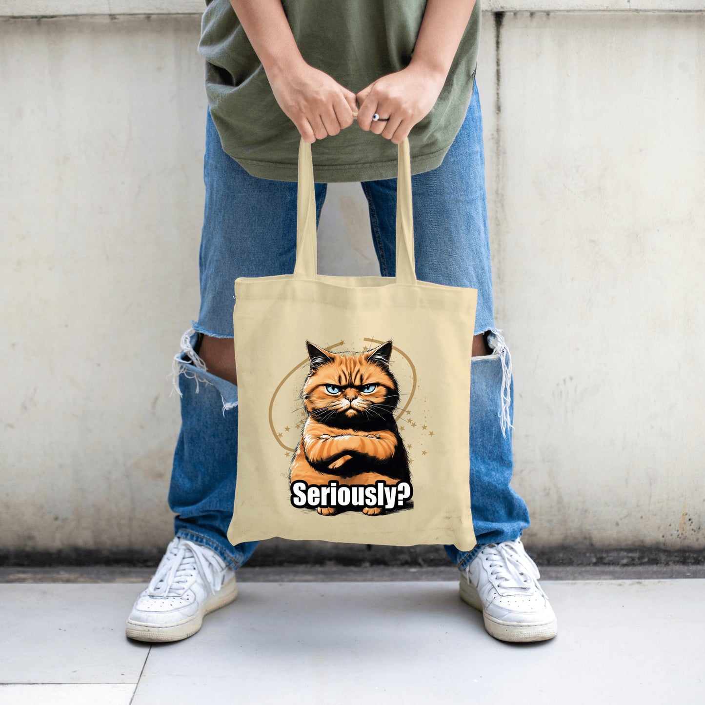 Cotton canvas tote bag featuring a judgmental cartoon tomcat and bold text saying “SERIOUSLY?” with a deadpan expression.