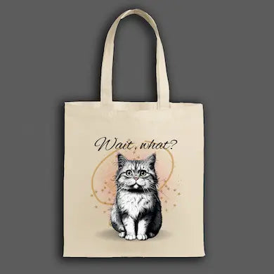 Funny canvas tote bag with shocked cartoon cat and large text “WAIT, WHAT?!” in expressive comic-style lettering.