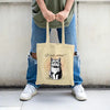 Funny canvas tote bag with shocked cartoon cat and large text “WAIT, WHAT?!” in expressive comic-style lettering.