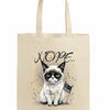 A beige canvas tote bag featuring a grumpy cartoon cat with the word “NOPE” in bold block letters.