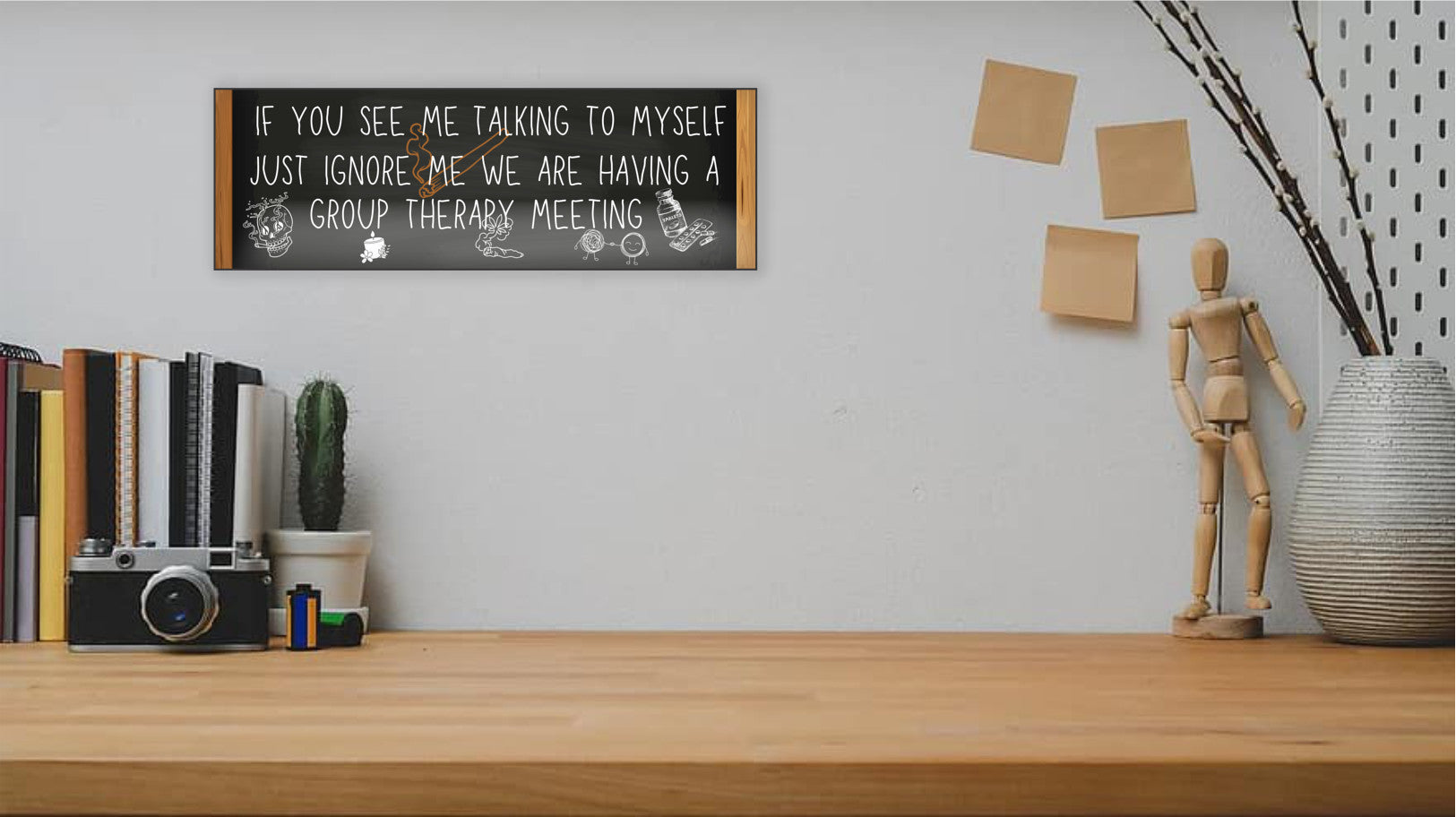 T-shirt with text: “If you see me talking to myself, just ignore me—we’re having a group therapy meeting.” Funny mental health quote tee in bold font.