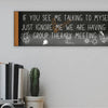 T-shirt with text: “If you see me talking to myself, just ignore me—we’re having a group therapy meeting.” Funny mental health quote tee in bold font.