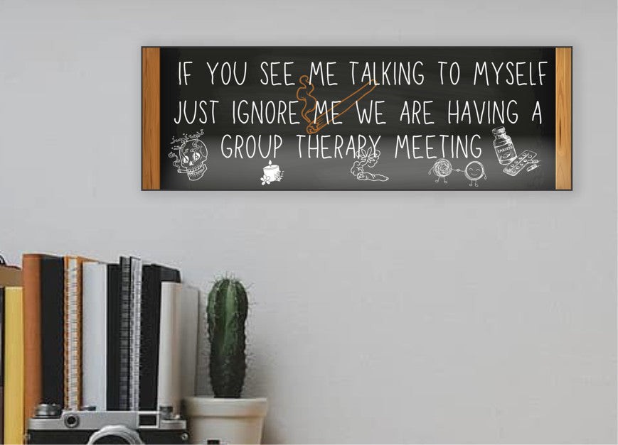 T-shirt with text: “If you see me talking to myself, just ignore me—we’re having a group therapy meeting.” Funny mental health quote tee in bold font.