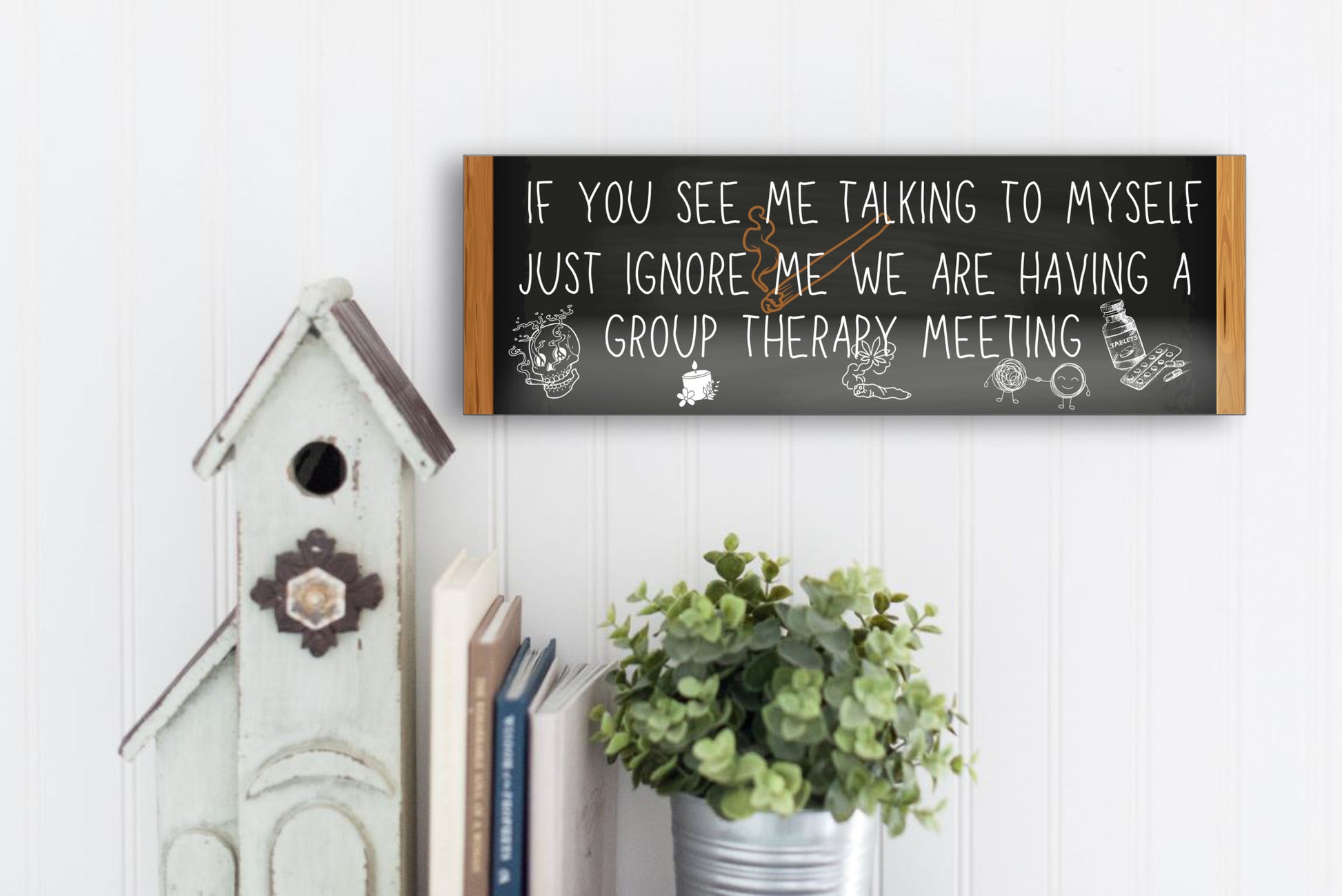 T-shirt with text: “If you see me talking to myself, just ignore me—we’re having a group therapy meeting.” Funny mental health quote tee in bold font.