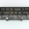T-shirt with text: “If you see me talking to myself, just ignore me—we’re having a group therapy meeting.” Funny mental health quote tee in bold font.
