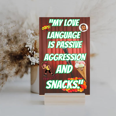Wooden plaque with bold comic-style text: “My Love Language is Passive” displayed in a modern font on a rustic wood background.
