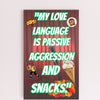 Wooden plaque with bold comic-style text: “My Love Language is Passive” displayed in a modern font on a rustic wood background.
