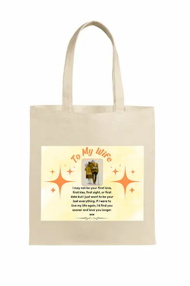 Person holding a beige tote bag with a Romantic first kiss quote tote bag gift for wife