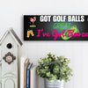Funny golf cart plaque that reads "Got Golf Balls? Great. I’ve Got Booze." with neon text and bar cart imagery.