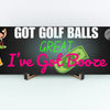 Funny golf cart plaque that reads "Got Golf Balls? Great. I’ve Got Booze." with neon text and bar cart imagery.