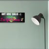 Funny golf cart plaque that reads "Got Golf Balls? Great. I’ve Got Booze." with neon text and bar cart imagery.