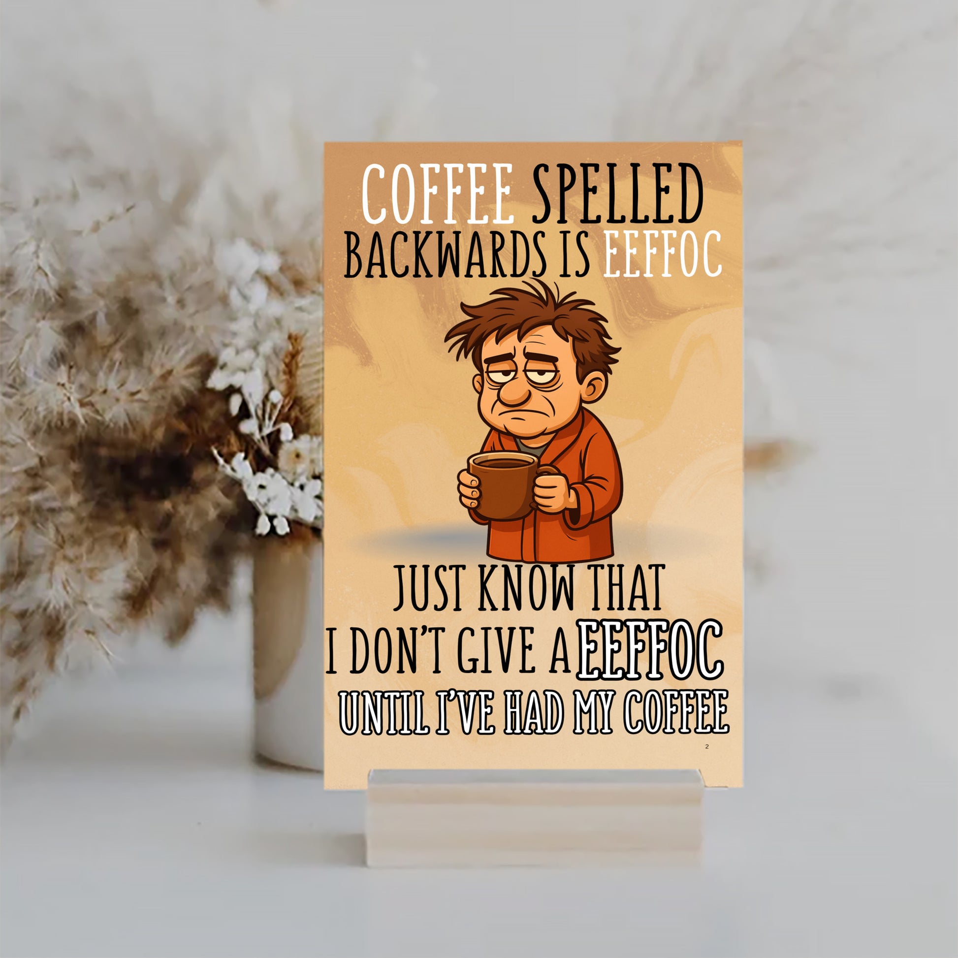 MFD plaque with text “Coffee spelled backward is EEFFOC. I don’t give EEFFOC until I’ve had my coffee.” in bold comic-style lettering.