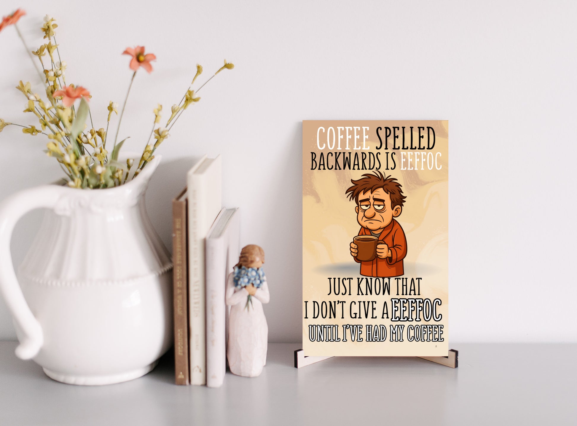 MFD plaque with text “Coffee spelled backward is EEFFOC. I don’t give EEFFOC until I’ve had my coffee.” in bold comic-style lettering.