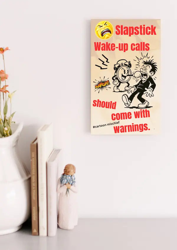 “Funny wall plaque reading 'Slapstick Wake Up Calls Should Come with Warnings' displayed on a kitchen wall near a coffee mug”