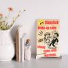 “Funny wall plaque reading 'Slapstick Wake Up Calls Should Come with Warnings' displayed on a kitchen wall near a coffee mug”