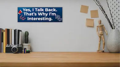 Funny humorous wall plaque with the phrase “YES, I TALK BACK – THAT’S WHY I’M INTERESTING” in bold lettering.