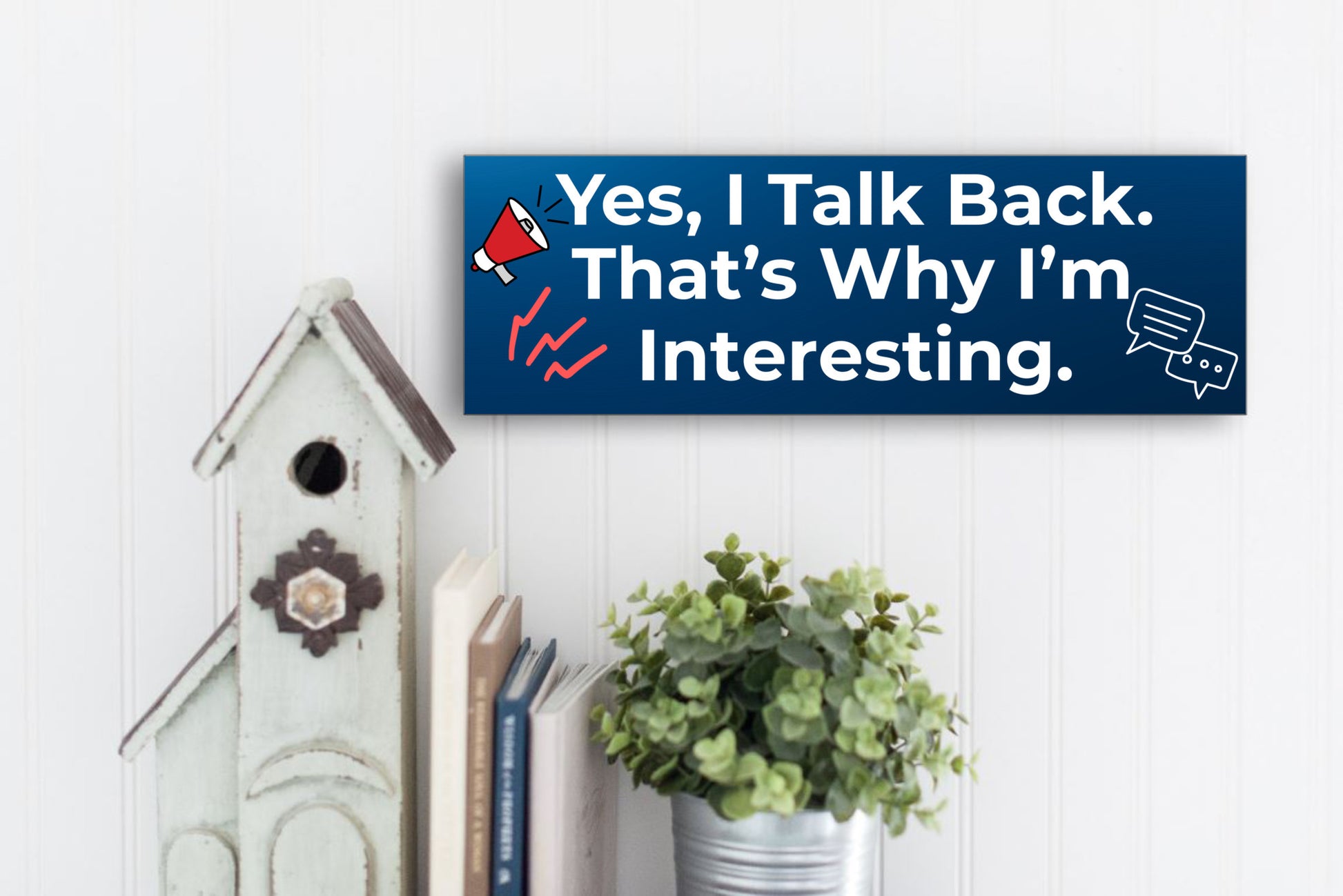 Funny humorous wall plaque with the phrase “YES, I TALK BACK – THAT’S WHY I’M INTERESTING” in bold lettering.