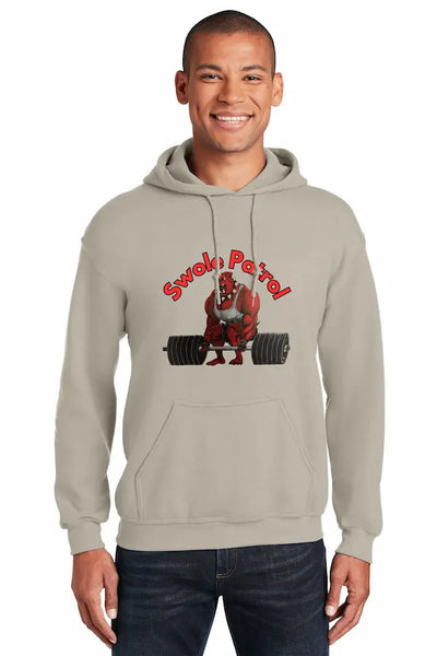 Man wearing SWOLE PATROL Hoodie flexing in gym with dumbbells.