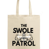 Swole Patrol Tote in matte black, roomy design with gym and lifestyle essentials, carried by athlete in urban gym setting