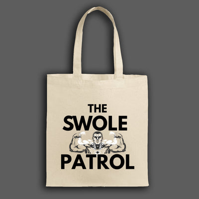 Swole Patrol Tote in matte black, roomy design with gym and lifestyle essentials, carried by athlete in urban gym setting