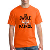 Athlete lifting weights wearing The Swole Patrol black performance T-shirt in industrial gym.