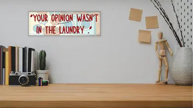 Sarcastic wall plaque with the phrase “Your Opinion Wasn’t in the Laundry” – bold home office décor gift