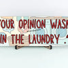 Sarcastic wall plaque with the phrase “Your Opinion Wasn’t in the Laundry” – bold home office décor gift
