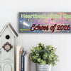 Plaque design reading Heartbeat of the Game, Echoes of 2026 with heartbeat line shaping into a World Cup ball, radiating soundwaves.