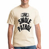 “Man wearing a beige T-shirt with bold black text that reads ‘The Swole Patrol’ featuring flexing arm graphics.”