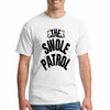 “Man wearing a beige T-shirt with bold black text that reads ‘The Swole Patrol’ featuring flexing arm graphics.”