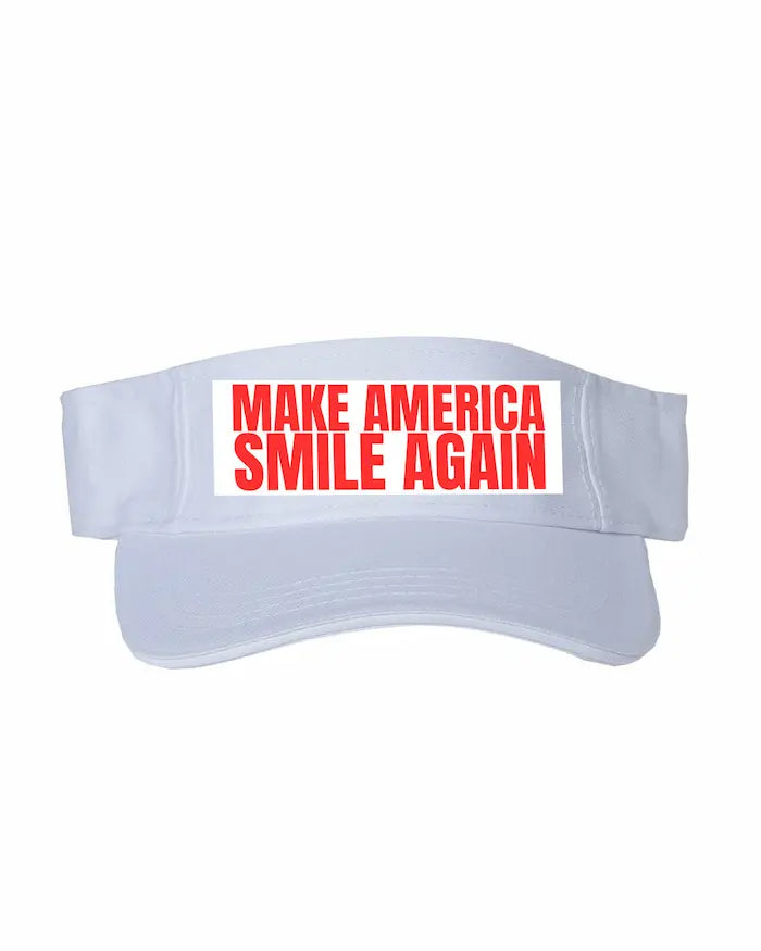  White Sportsman visor with bold embroidered slogan “MAKE AMERICA SMILE AGAIN.”