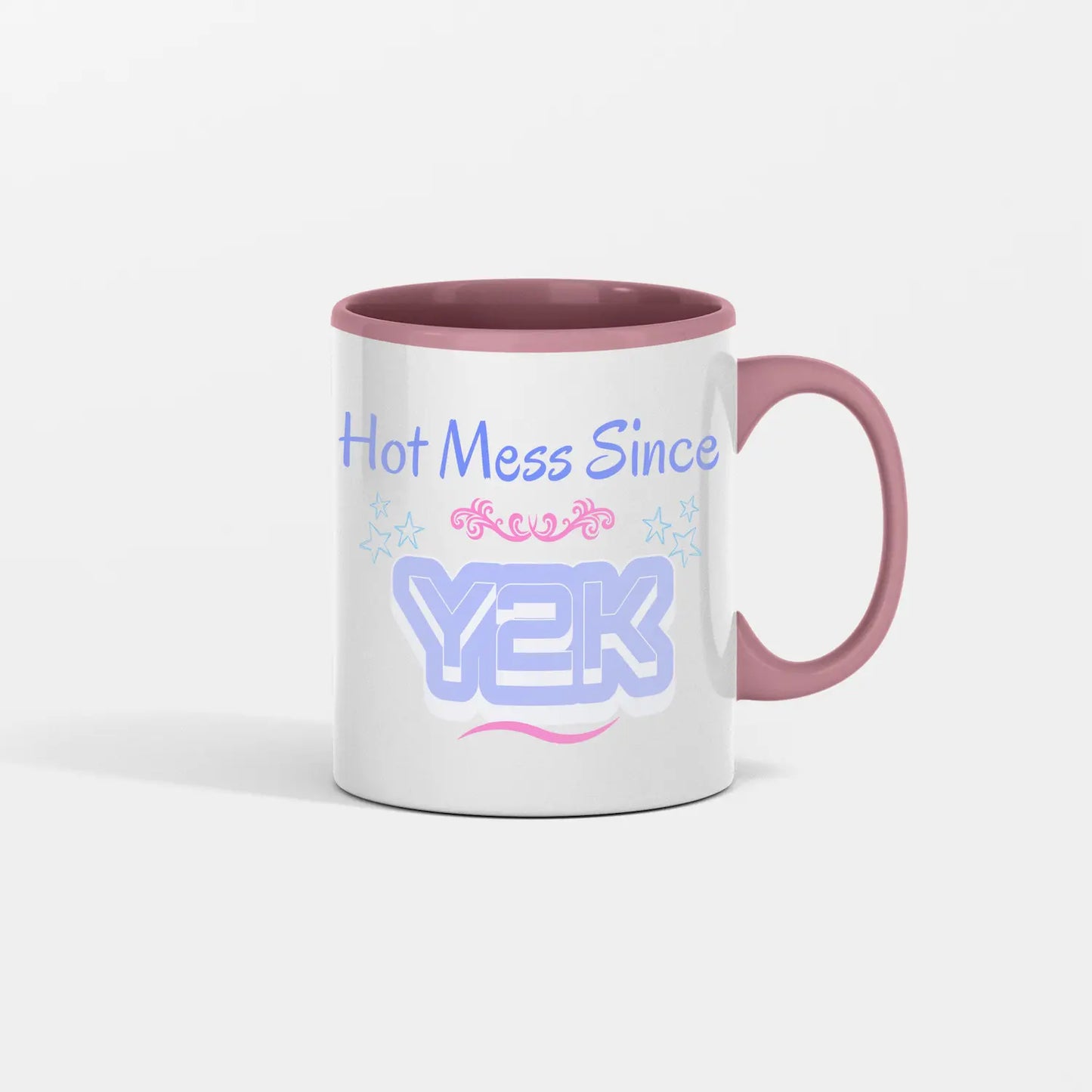 “Hot Mess Since Y2K 2.0 ceramic coffee mug featuring bold retro text, nostalgic pink-and-black 2000s aesthetic, and humorous design celebrating modern chaos.”