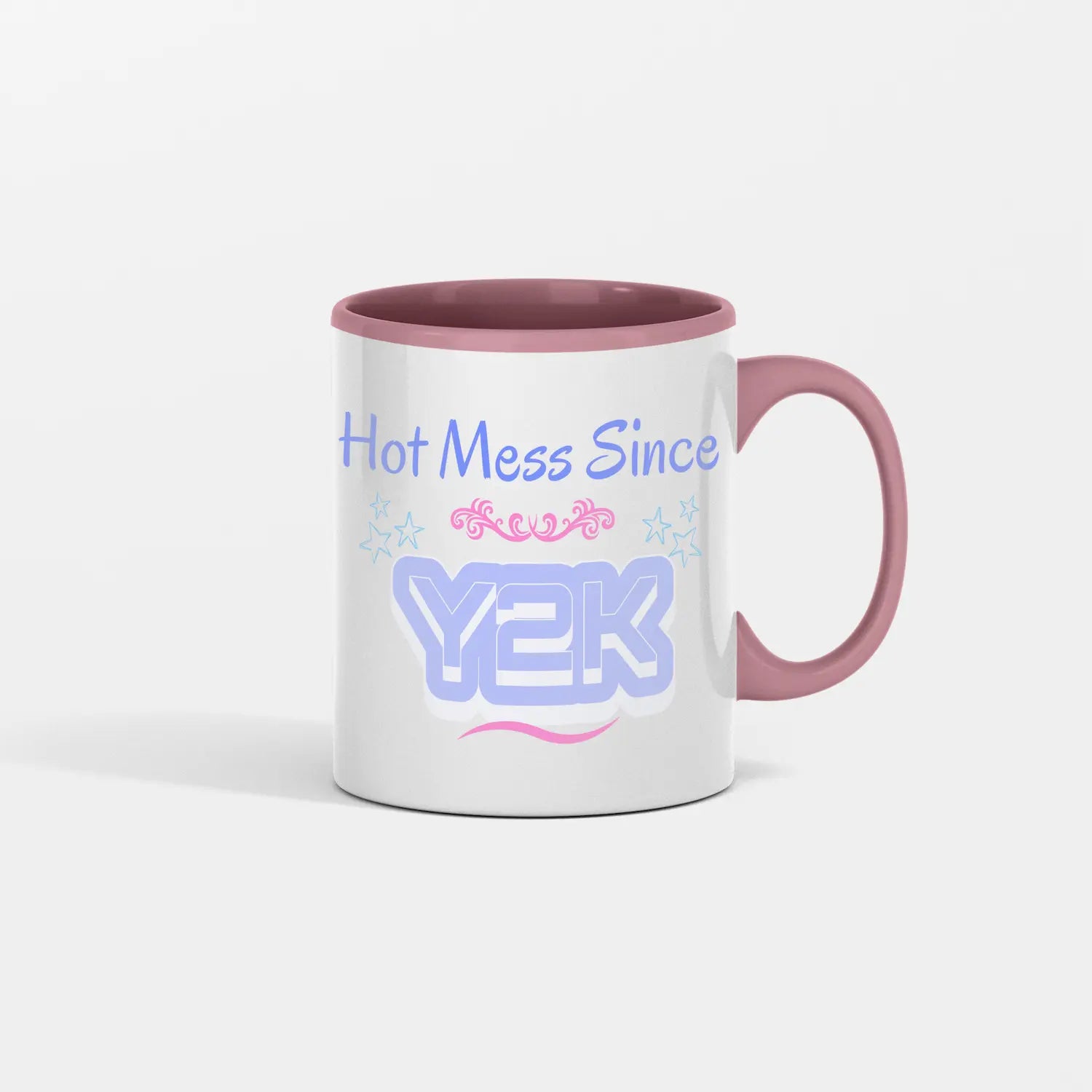 “Hot Mess Since Y2K 2.0 ceramic coffee mug featuring bold retro text, nostalgic pink-and-black 2000s aesthetic, and humorous design celebrating modern chaos.”