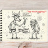 Notebook with a Christmas-themed illustration of a reindeer and a person, with text 'Too much eggnog?' on a wooden surface.