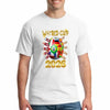 Bold white World Cup 2026 T-shirt featuring vibrant multicolor flags and “UNITED IN CHAOS” typography, modeled in a festive street scene of fans celebrating.