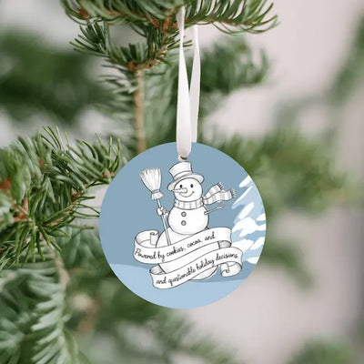 Handdrawn snowman Christmas ornament with cookie-themed details, illustrated sketch style, no background.