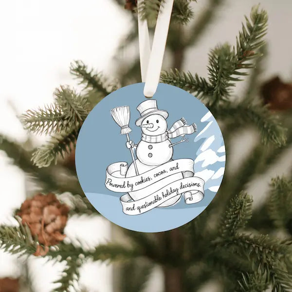 Handdrawn snowman Christmas ornament with cookie-themed details, illustrated sketch style, no background.