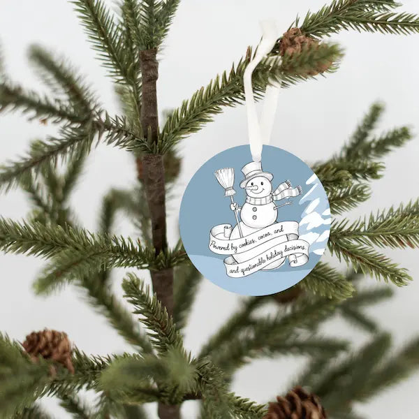 Handdrawn snowman Christmas ornament with cookie-themed details, illustrated sketch style, no background.