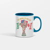 Hand-drawn illustration on a white ceramic The World is Ballin Fandom Soccer Mug with swirling global flags and soccer-themed parody artwork.