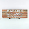 “Funny sarcastic plaque reading ‘I’m Not Old, I’m Classic Possibly Vintage’ printed on MDF retro-style wall sign”