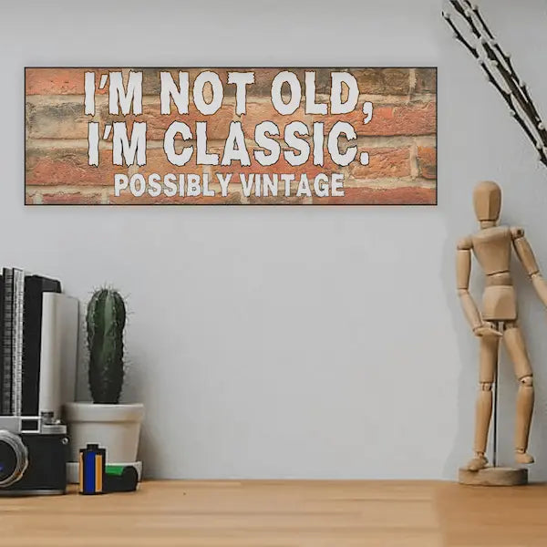 “Funny sarcastic plaque reading ‘I’m Not Old, I’m Classic Possibly Vintage’ printed on MDF retro-style wall sign”